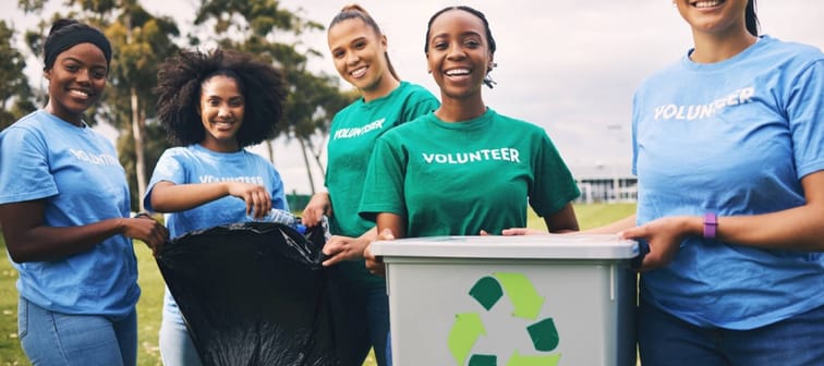 Young people recycling — volunteer portrait of group doing outdoor waste and garbage cleaning