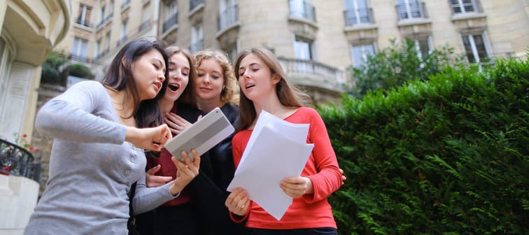 Students reviewing information about school campus