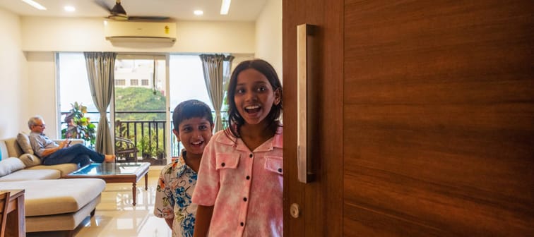 South Asian children open the door to family with a warm welcome