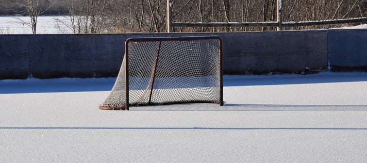 Hockey net in the middle of the community skating rink