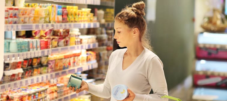 Woman comparison shops to cut down cost of living expenses