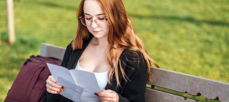 Young woman considering paperwork