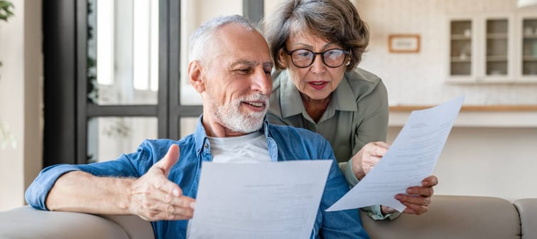 Elderly couple discuss bills