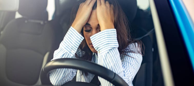 Stressed woman in car