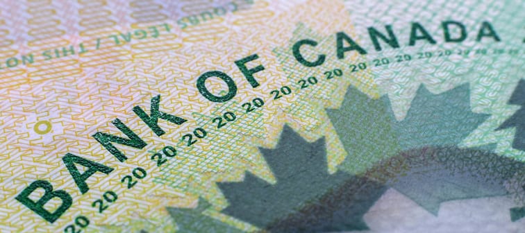 Closeup macro Bank of Canada words on a green $20 Canadian money bill