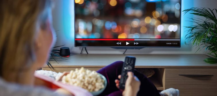 Woman relaxing watching Netflix