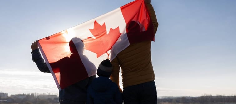 Proud Canadians holding flag