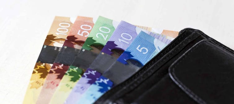 Canadian Dollars in a open black leather vallet