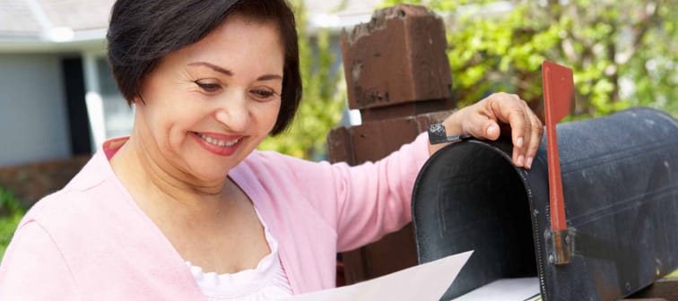 Senior Hispanic Woman Checking Mailbox
