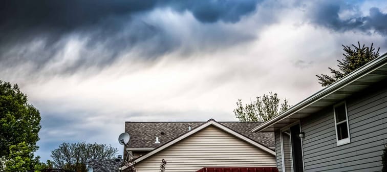 Thunderstorm clouds over suburban houses