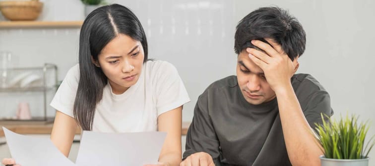 Stressed asian young couple