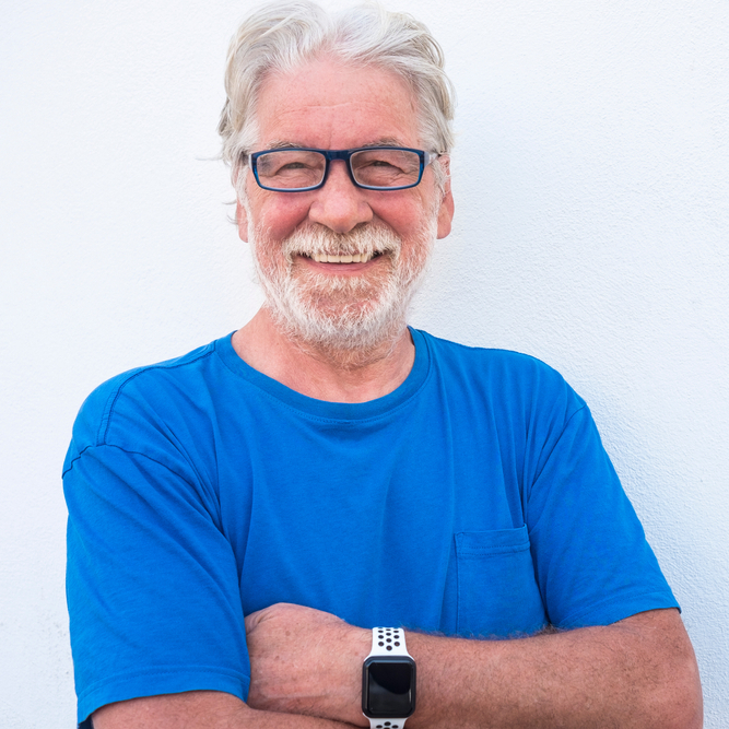 Retired older man smiling at the camera