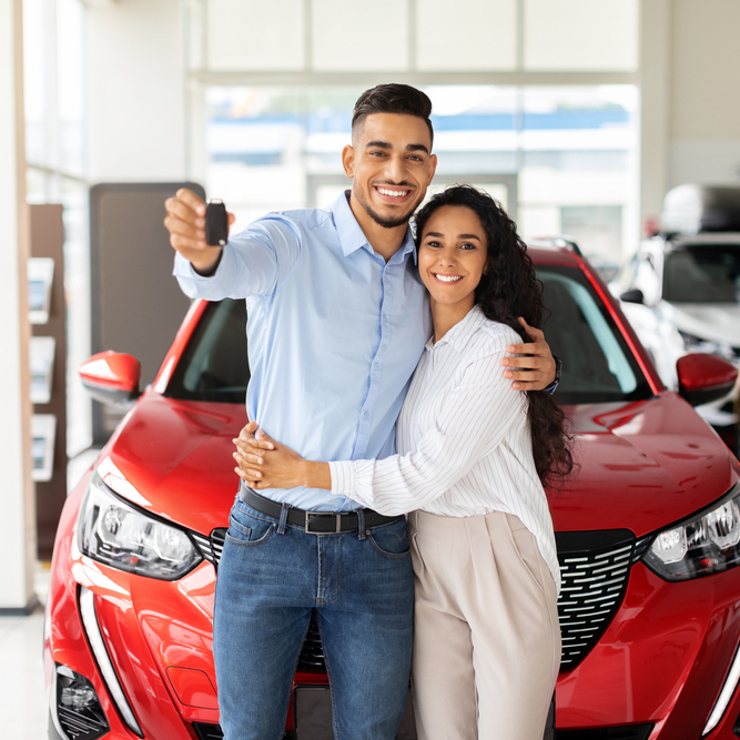Young family buying new car