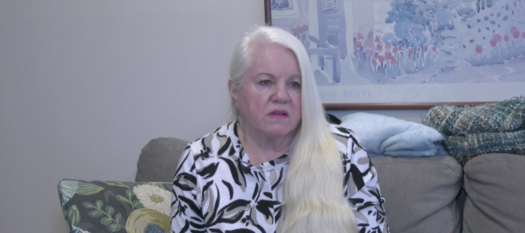 Woman being interviewed on the news.