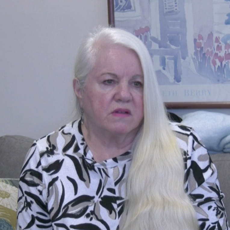 Woman being interviewed on the news.