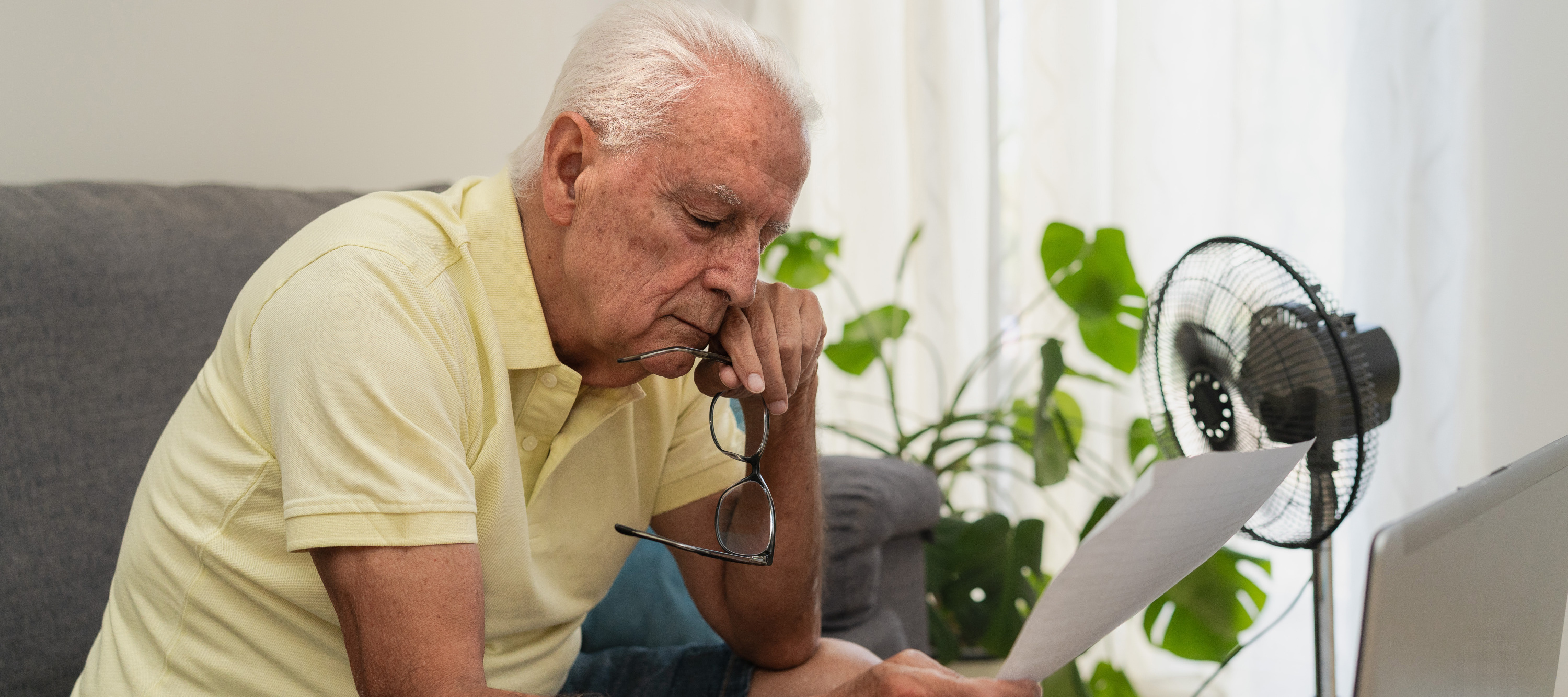 Senior looking at bills