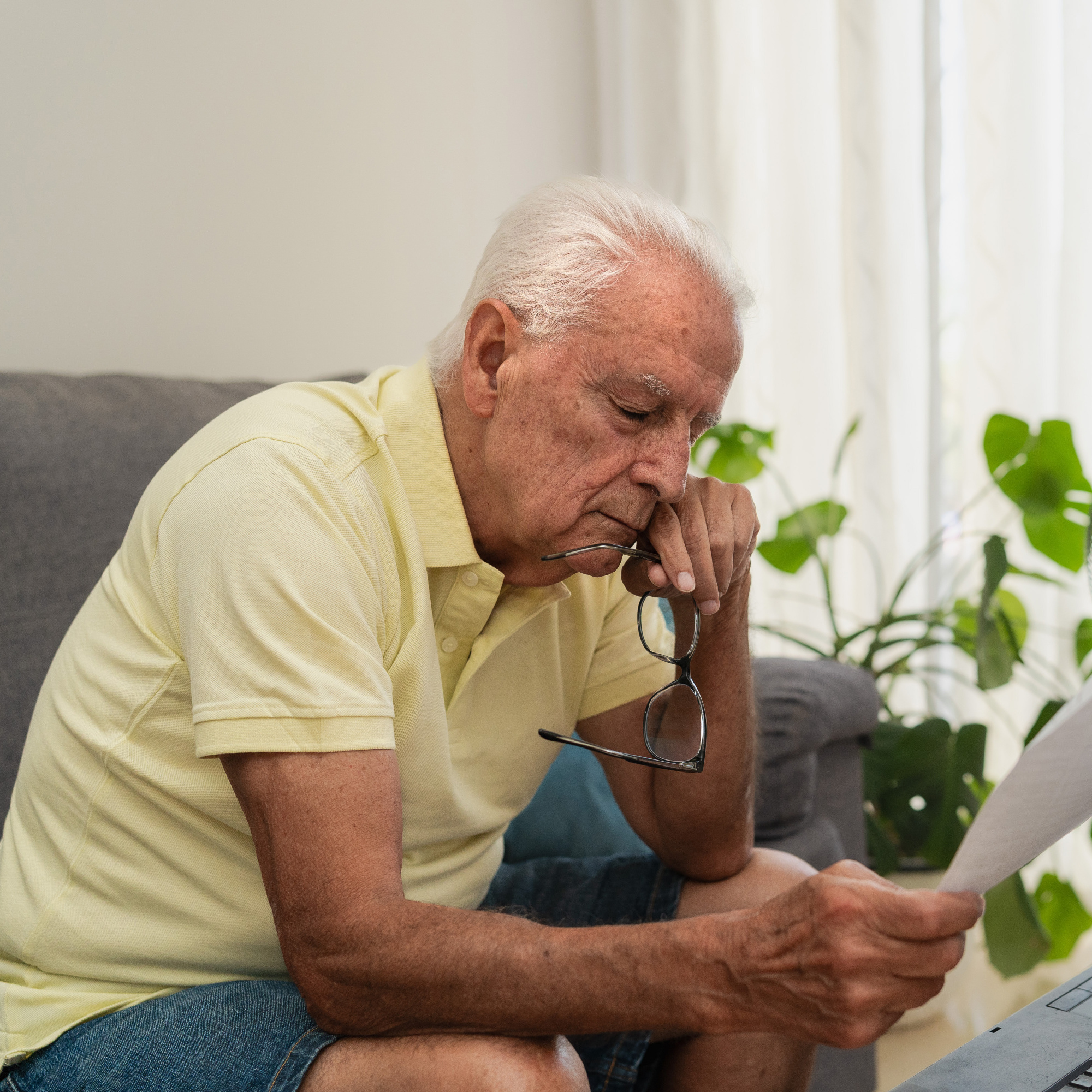 Senior looking at bills