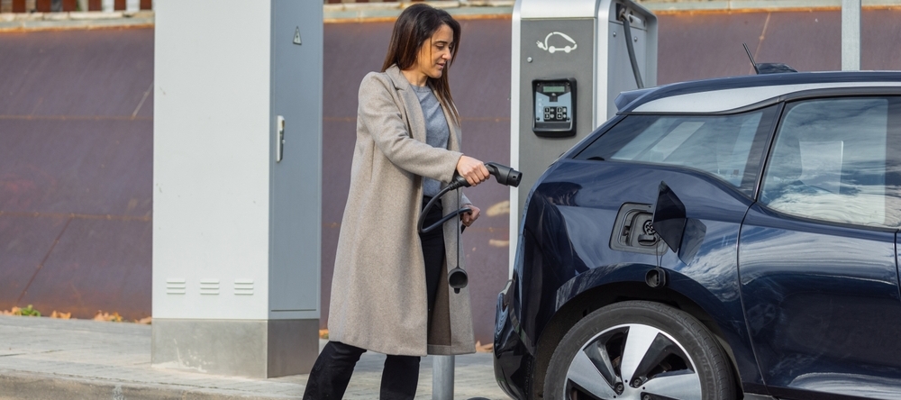 Woman charging EV