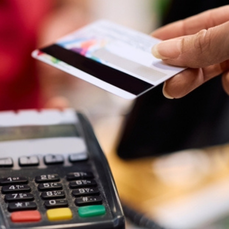 Close up of customer using credit card