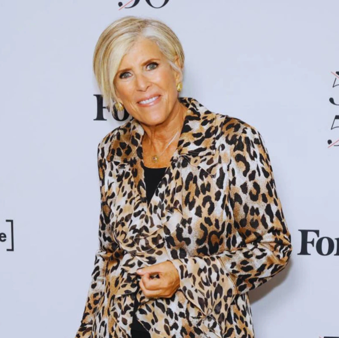 Suze Orman and John Oliver