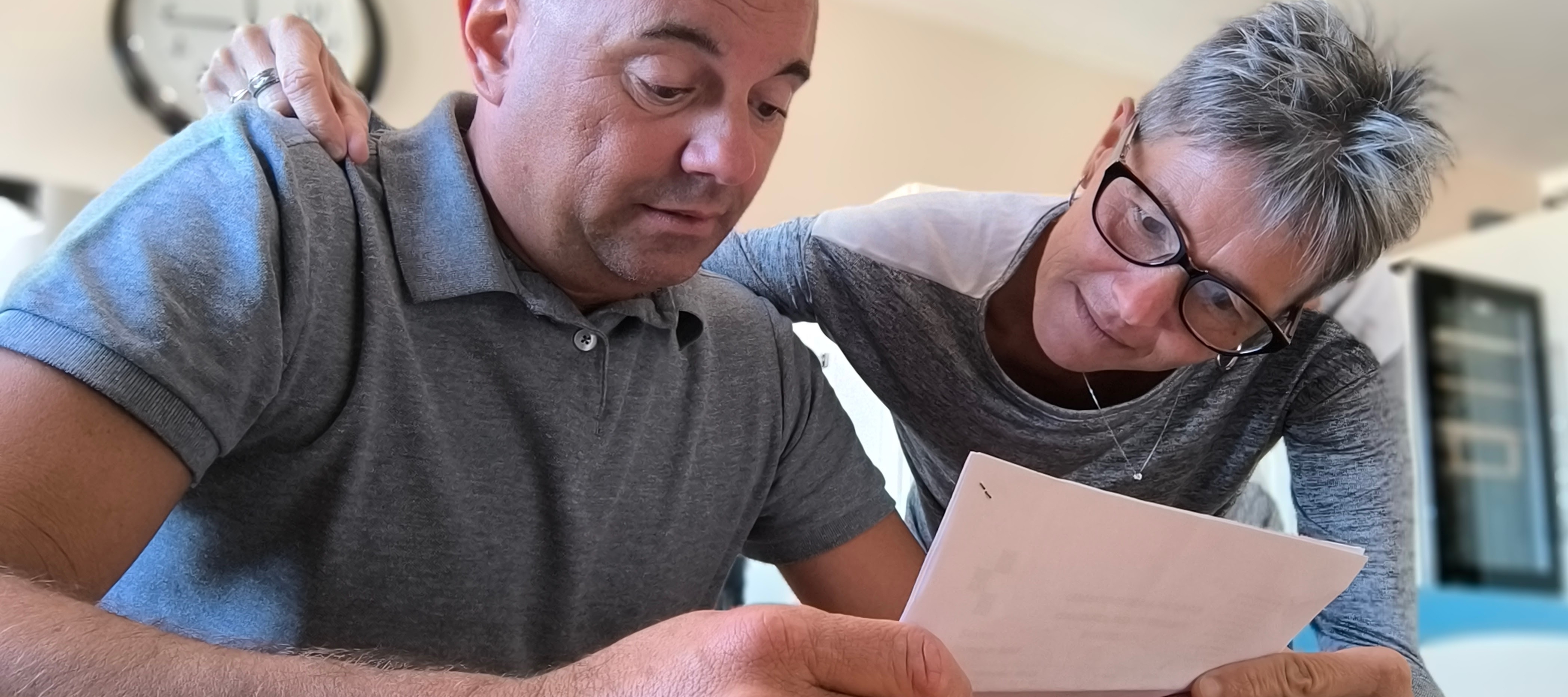 Older couple reviewing finances and looking anxious
