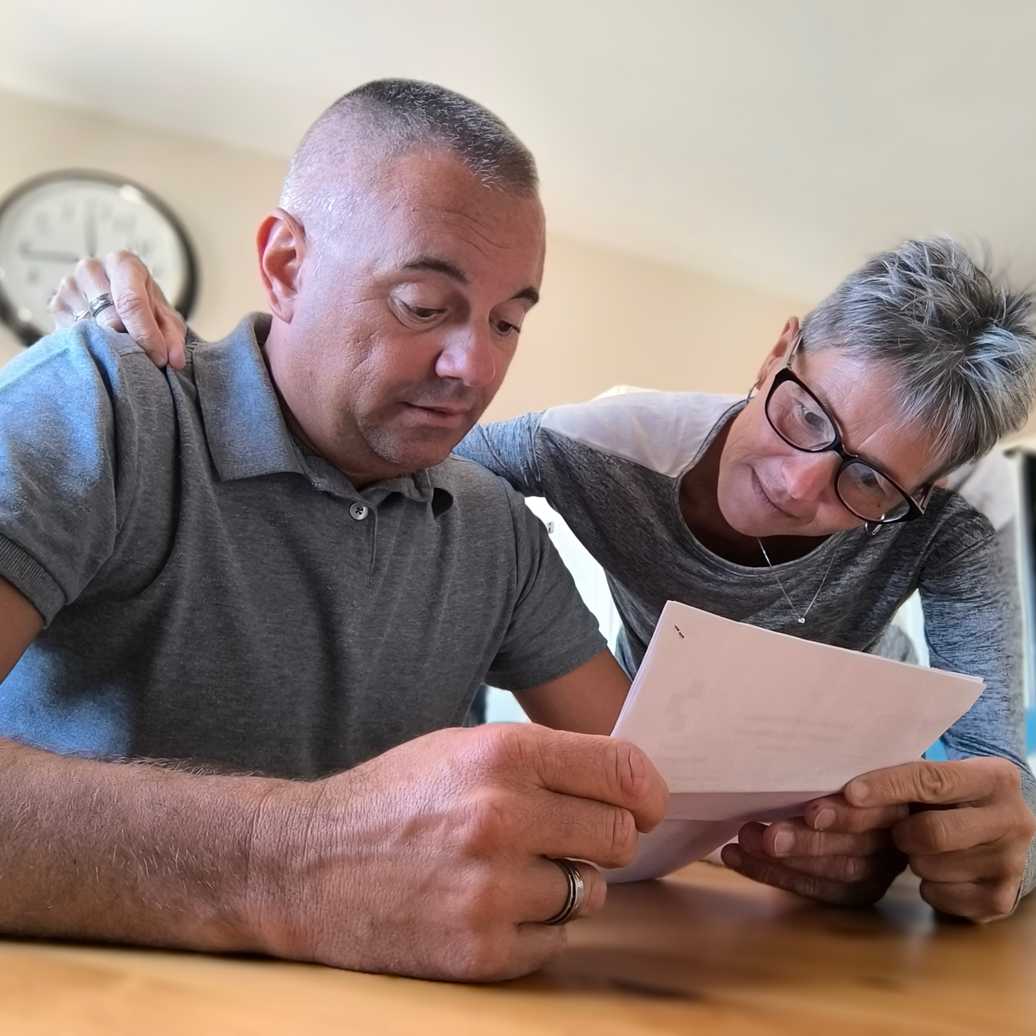 Older couple reviewing finances and looking anxious