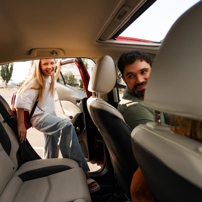 Daughter getting into her dad's car