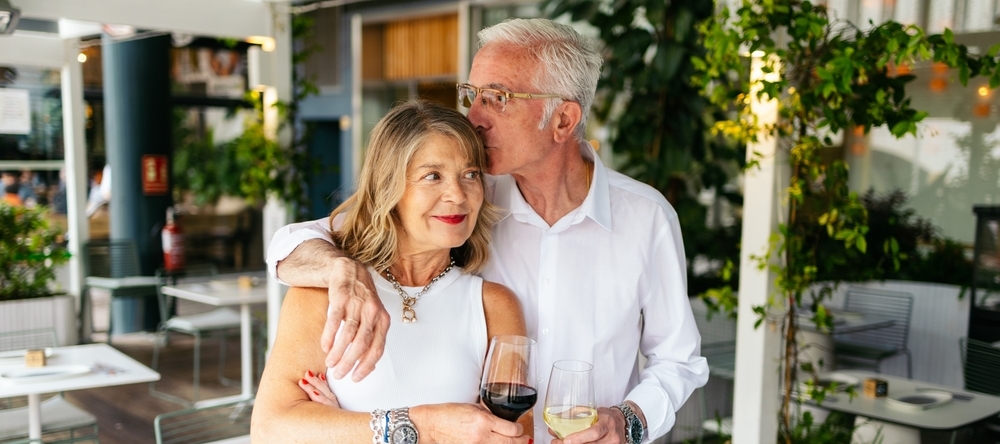 Senior married couple embracing one antoher