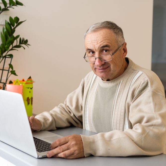 Older man checking his finances online