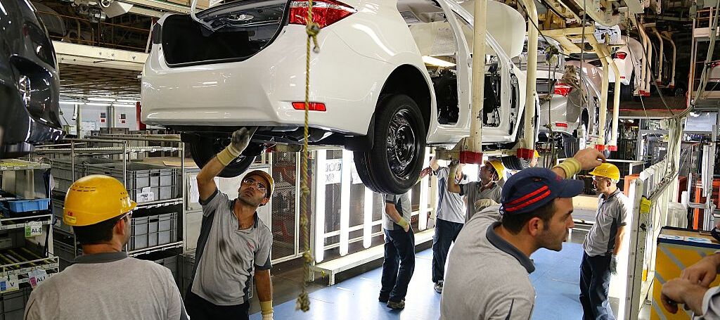 Factory workers assembling Toyota vehicles, 2014