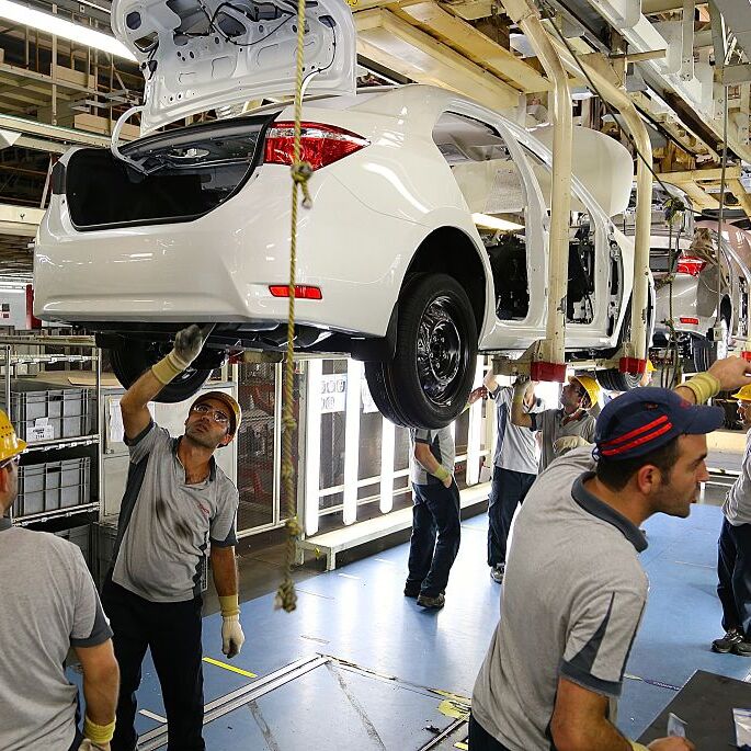 Factory workers assembling Toyota vehicles, 2014