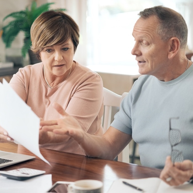 Couple discussing finances looking stressed