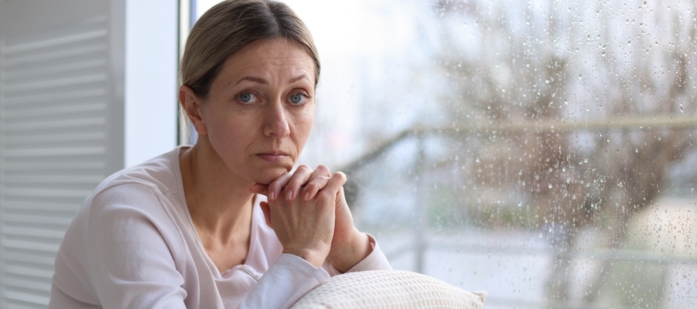 Middle-aged woman looking stressed