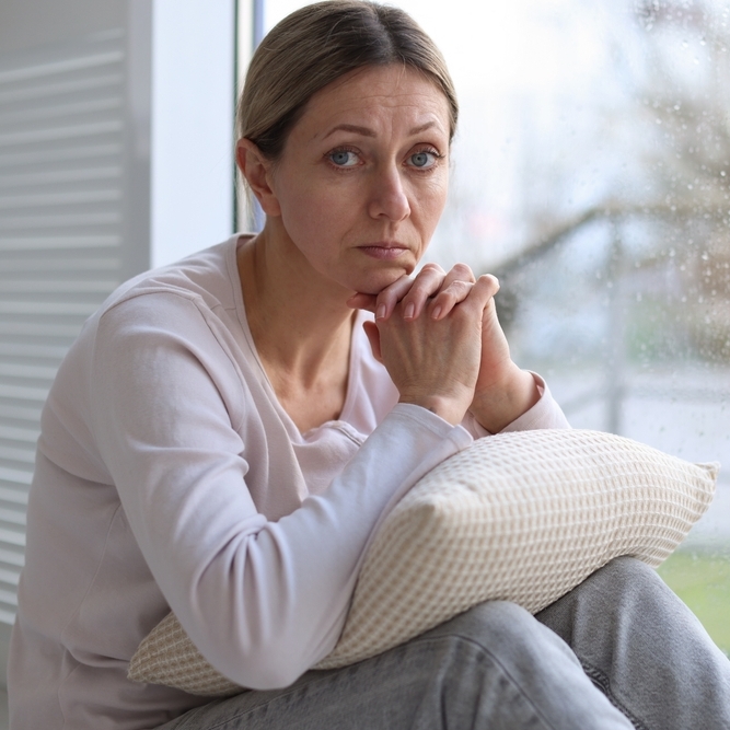 Middle-aged woman looking stressed