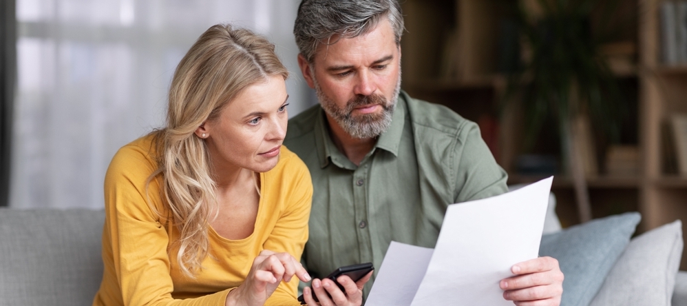 Man and woman looking at papers
