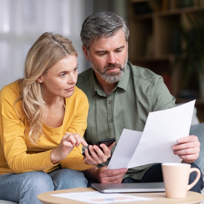 Man and woman looking at papers