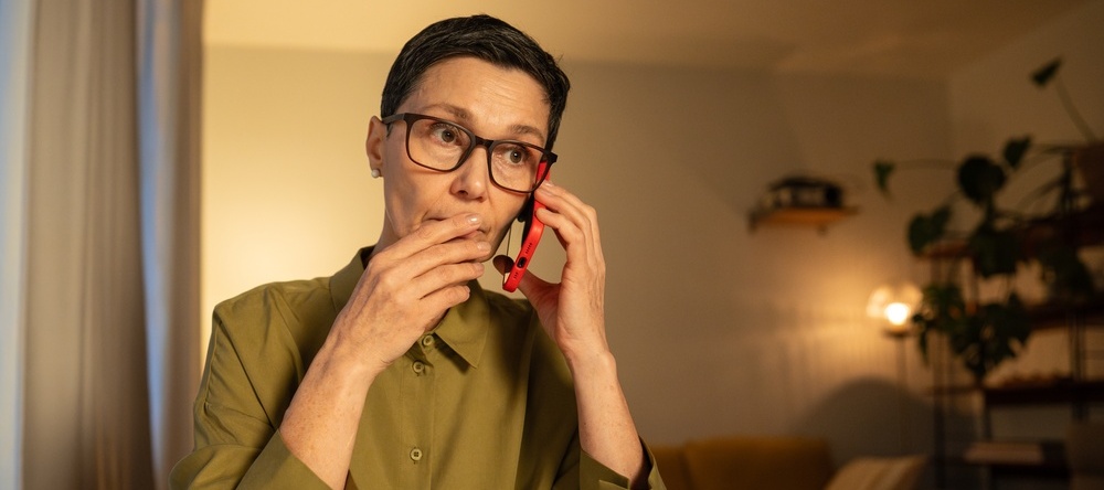 Woman on phone looking concerned