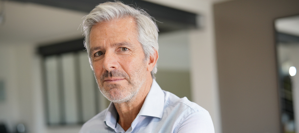 Portrait of a grey-haired, 50-year-old man