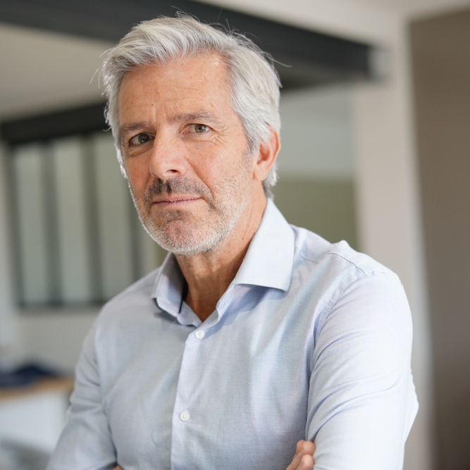 Portrait of a grey-haired, 50-year-old man