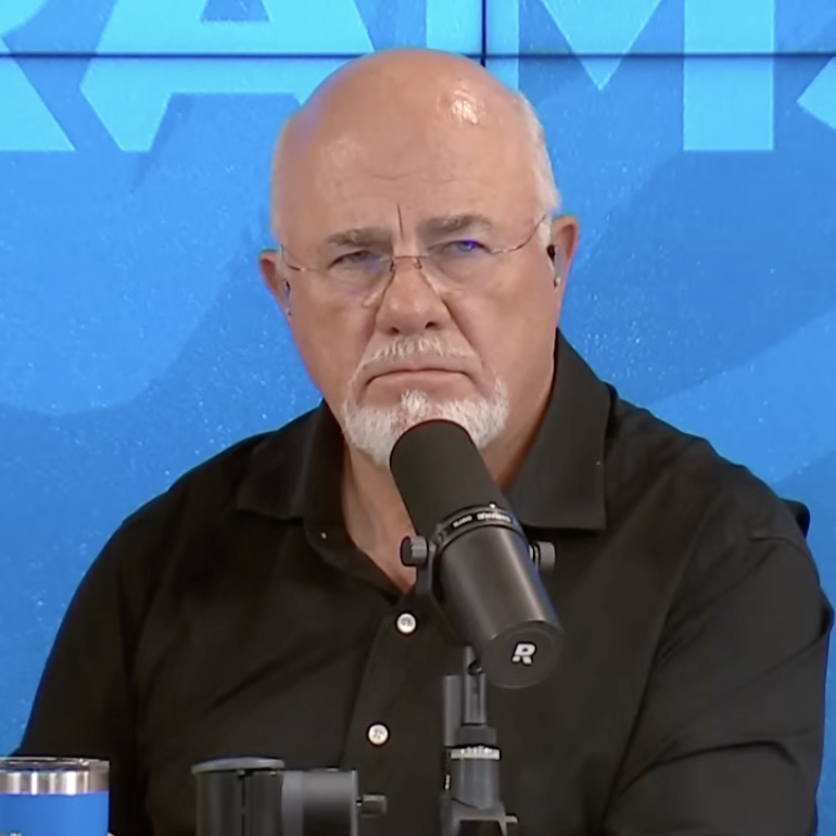 Dave Ramsey sitting at a desk