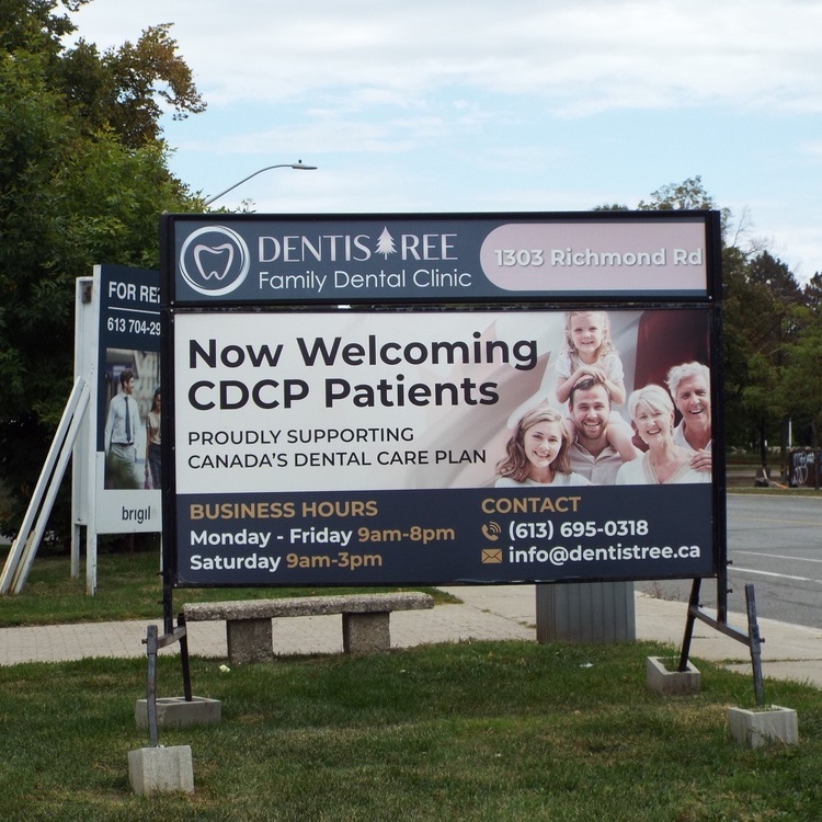 A roadside promotional sign for "DentisTree Family Dental Clinic" announces its acceptance of CDCP patients and lists business hours on Richmond Rd in Ottawa, Canada