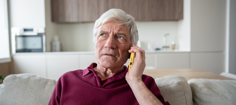 Distrustful and anxious retiree on a service help call.