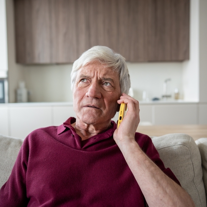 Distrustful and anxious retiree on a service help call.