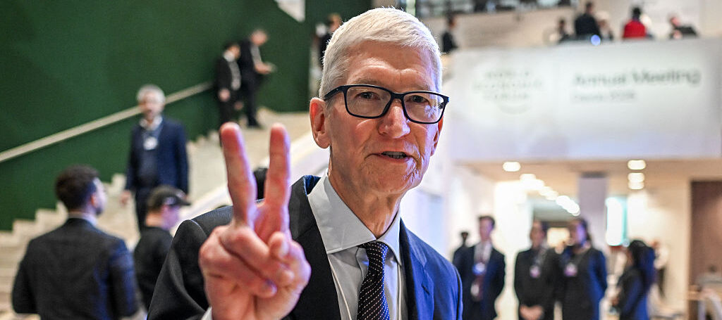 Tim Cook giving the peace sign