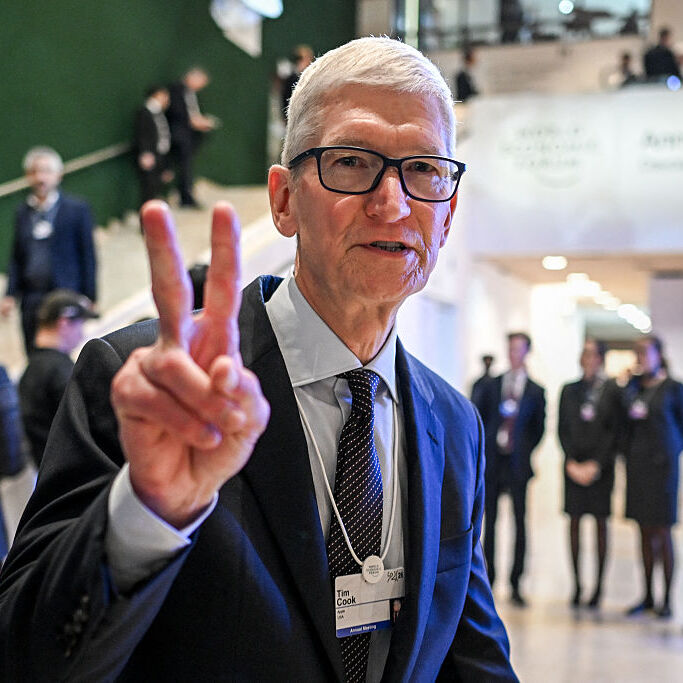 Tim Cook giving the peace sign