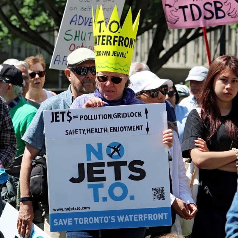 Image of protestors at a rally about Billy Bishop expansion, photo of Billy Bishop airport building
