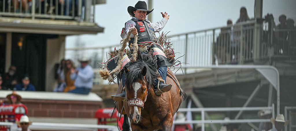 addle Bronc rider, Wyatt Casper from Miami, Texas, rides Come Along, in action during the 2025 edition of the Calgary Stampede in Calgary, Alberta