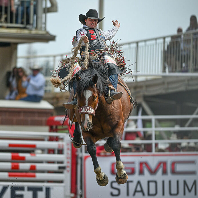 addle Bronc rider, Wyatt Casper from Miami, Texas, rides Come Along, in action during the 2025 edition of the Calgary Stampede in Calgary, Alberta