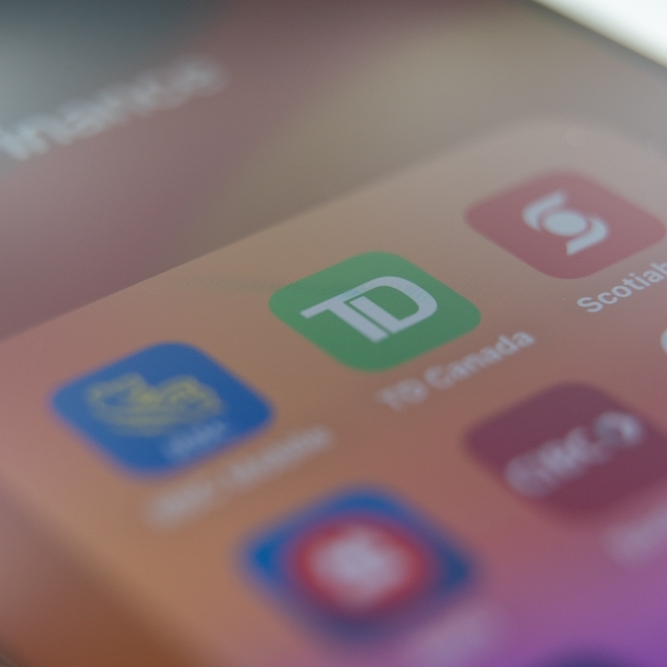 Mobile applications of popular banks in Canada. Bank applications on phone screen.