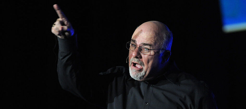 Dave Ramsey giving an impassioned speech pointing his figure in the air
